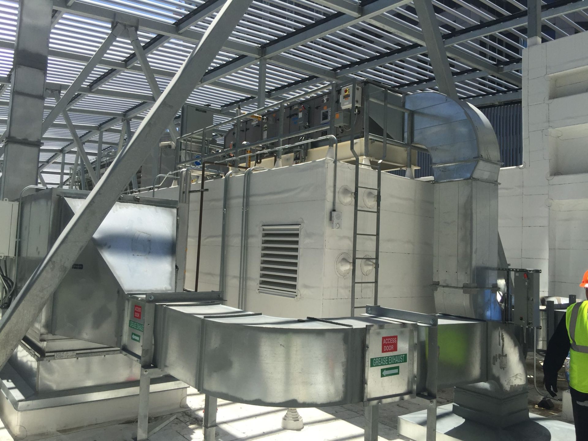Commercial kitchen exhaust system with pollution control unit and grease exhaust ductwork